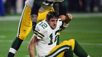 Dec 27, 2015; Glendale, AZ, USA; Green Bay Packers guard Josh Walker (79) helps up Green Bay Packers quarterback Aaron Rodgers (12) against the Arizona Cardinals during the second half at University of Phoenix Stadium. Mandatory Credit: Joe Camporeale-USA TODAY Sports